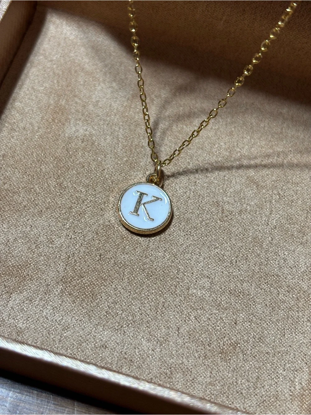 Gold tone initial K pendant necklace